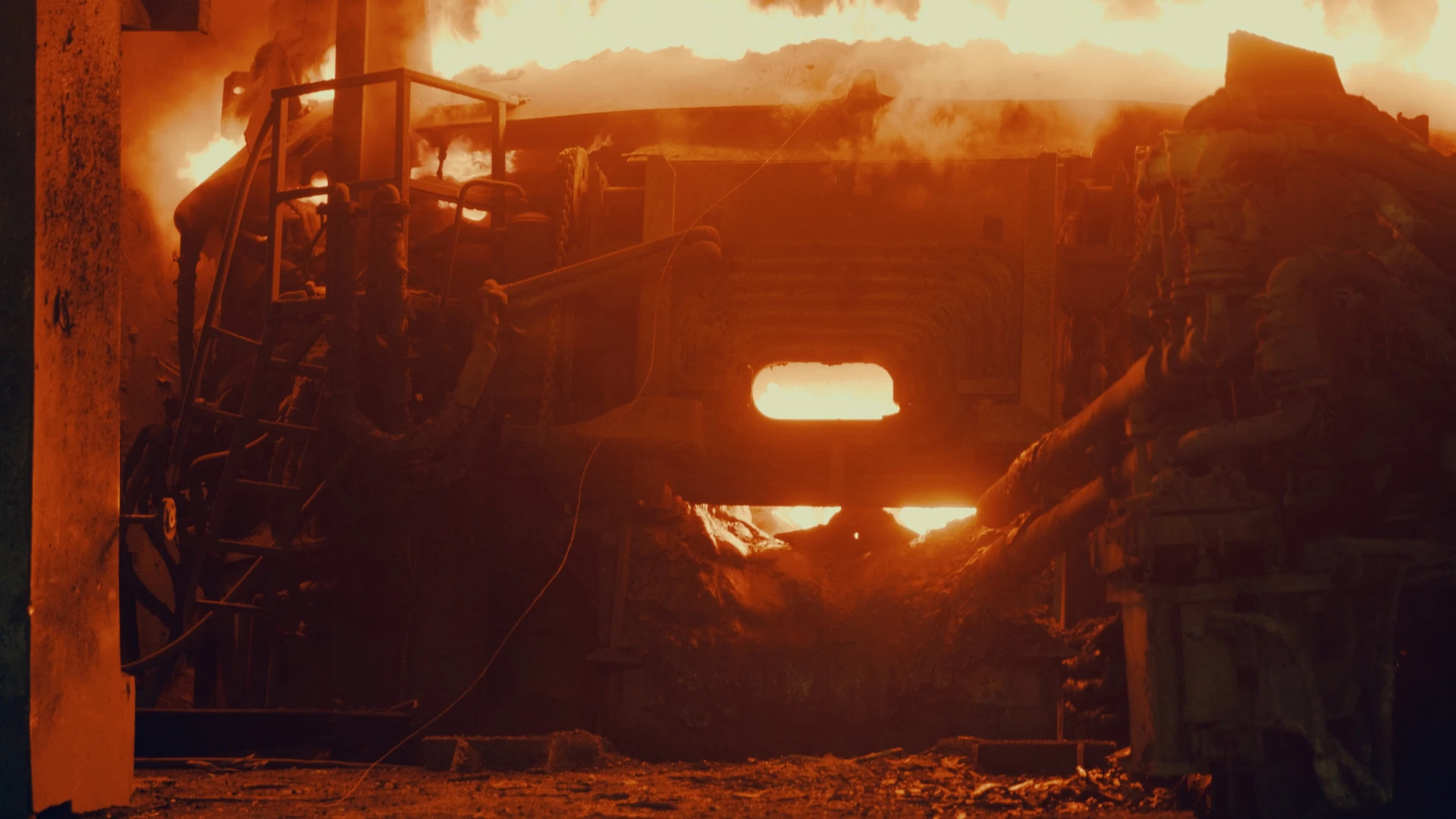 Metallurgical Coke Supplier – interior of a metallurgical furnace with glowing coke, intensive operation of a high-temperature installation during steel production.