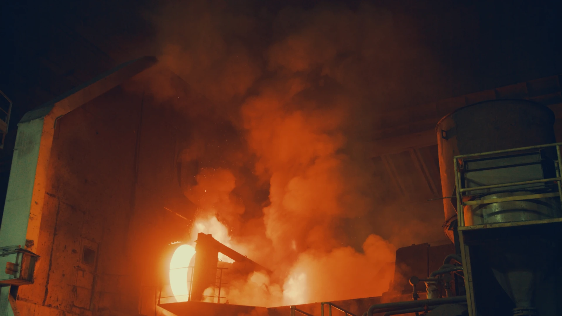 Metallurgical Coke Supplier – smelting process in a steel plant, glowing coke and intense heat emissions during industrial operation.