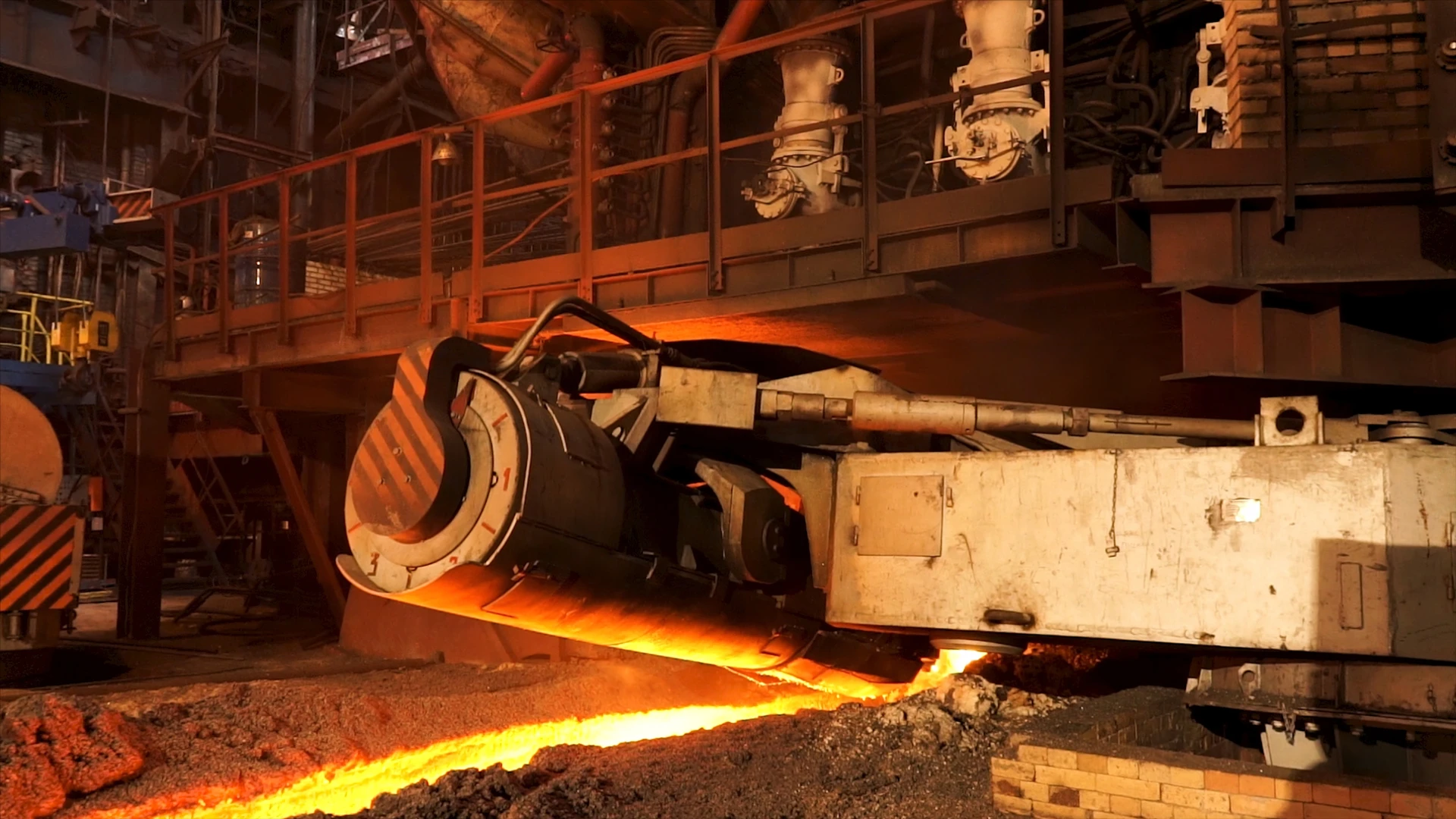 Metallurgical Coke Supplier – molten metal tapping line in a steel plant, industrial installation operating with metallurgical coke in the steel smelting process.