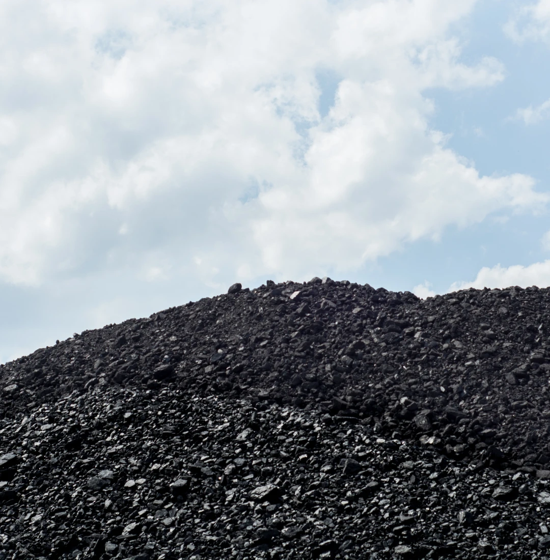 Coal supplier in Silesia – a heap of black hard coal against the sky, symbol of the region’s energy industry.